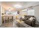 Inviting living room featuring an open layout with a dining area and seamless flow to a well-equipped kitchen at 2103 N Silverton St, Mesa, AZ 85203