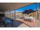 Outdoor dining and relaxing area with pool access and shade; ideal for enjoying meals and socializing outdoors at 2103 N Silverton St, Mesa, AZ 85203
