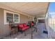 Comfortable covered patio with outdoor seating and a view of the refreshing swimming pool at 2103 N Silverton St, Mesa, AZ 85203