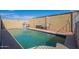 Inviting pool area with a cabana, chair, and privacy wall, perfect for outdoor relaxation and enjoyment at 2103 N Silverton St, Mesa, AZ 85203