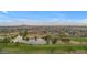 Aerial view of community with lake, landscaping and view to mountains at 2130 N Cypress Point N Way, Casa Grande, AZ 85122