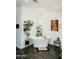 Bright bathroom with a freestanding tub under a chandelier and a plant for adding natural light at 2130 N Cypress Point N Way, Casa Grande, AZ 85122