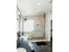 Beautiful bathroom with a large shower with pebble floor, built-in seat and tiled surround and black vanity at 2130 N Cypress Point N Way, Casa Grande, AZ 85122