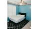 Bright bedroom with light blue walls, white shutters and a ceiling fan at 2130 N Cypress Point N Way, Casa Grande, AZ 85122