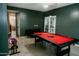 Bright, open game room with a pool table, comfortable sofa, and ample space for entertainment at 2130 N Cypress Point N Way, Casa Grande, AZ 85122