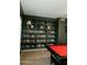 Stylish game room features built-in bookshelves and a bright red pool table, perfect for entertaining at 2130 N Cypress Point N Way, Casa Grande, AZ 85122