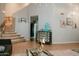 A spacious living room with stairs and creative art adds personality to the home at 2130 N Cypress Point N Way, Casa Grande, AZ 85122