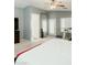 Open main bedroom offering a spacious area with a walkout door and light from shuttered windows at 2130 N Cypress Point N Way, Casa Grande, AZ 85122