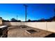 Fenced backyard with gravel and modern landscaping at 2210 E Birchwood Ave, Mesa, AZ 85204