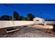 Fully-fenced backyard features minimal landscaping, and a storage shed at 2210 E Birchwood Ave, Mesa, AZ 85204