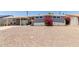Charming home featuring a spacious gravel yard and a beautiful bougainvillea in front at 2210 E Birchwood Ave, Mesa, AZ 85204