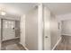 Bright hallway featuring updated lighting and neutral colors at 2210 E Birchwood Ave, Mesa, AZ 85204