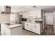 Updated kitchen featuring modern appliances and granite countertops at 2210 E Birchwood Ave, Mesa, AZ 85204