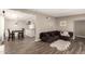 Open-concept living room featuring wood-look tile flooring and neutral paint at 2210 E Birchwood Ave, Mesa, AZ 85204