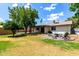 Spacious backyard features a fire pit and ample space for outdoor entertaining and relaxation at 2215 W Straford Dr, Chandler, AZ 85224