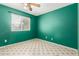 Bright bedroom with green walls, neutral floors, ceiling fan, and natural light at 2215 W Straford Dr, Chandler, AZ 85224