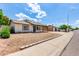 Charming home with low-maintenance front yard landscaping, a covered porch and street view at 2215 W Straford Dr, Chandler, AZ 85224