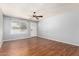 Bright living room boasts wood-look floors, fresh paint, and a front door entrance at 2215 W Straford Dr, Chandler, AZ 85224