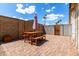 Charming patio area featuring a dining table set with an umbrella, perfect for outdoor meals at 2215 W Straford Dr, Chandler, AZ 85224