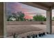 View of the backyard with gravel and plants, featuring a beautiful sky in the background at 2336 W Laredo Ln, Phoenix, AZ 85085