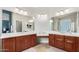 Bright bathroom featuring dual sink vanities with abundant counter space at 2336 W Laredo Ln, Phoenix, AZ 85085