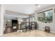 Bright breakfast nook area with seating and views into the living room at 2336 W Laredo Ln, Phoenix, AZ 85085