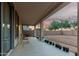 View of the covered patio with plants and spacious area, and a beautiful sky in the background at 2336 W Laredo Ln, Phoenix, AZ 85085
