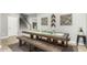 Dining room features a large wood table with bench seating and decorative wall art at 2336 W Laredo Ln, Phoenix, AZ 85085