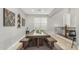 Open dining area with rustic wood table, bench seating, and stylish decor at 2336 W Laredo Ln, Phoenix, AZ 85085