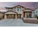Charming two-story home with a three-car garage and low maintenance front yard at 2336 W Laredo Ln, Phoenix, AZ 85085