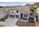 Aerial front elevation of a beautiful two-story home with a well-manicured lawn and a three-car garage at 2336 W Laredo Ln, Phoenix, AZ 85085