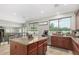 Open kitchen featuring granite counters, stainless steel appliances and a large island overlooking the breakfast nook at 2336 W Laredo Ln, Phoenix, AZ 85085