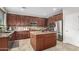 Well-appointed kitchen with stainless steel appliances, granite countertops, and center island at 2336 W Laredo Ln, Phoenix, AZ 85085