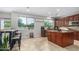 Spacious kitchen features a large center island, stainless steel appliances, and bright natural lighting at 2336 W Laredo Ln, Phoenix, AZ 85085
