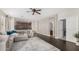 Open-concept living room showcasing dark wood floors and a comfortable gray sectional couch at 2336 W Laredo Ln, Phoenix, AZ 85085