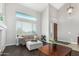 Bright living room with vaulted ceilings, cozy seating, and large windows at 2336 W Laredo Ln, Phoenix, AZ 85085