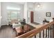 Upstairs view of the entry and living room with hardwood floors and natural light at 2336 W Laredo Ln, Phoenix, AZ 85085