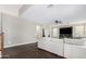Cozy living room showcases a large couch, hardwood floors and neutral paint at 2336 W Laredo Ln, Phoenix, AZ 85085