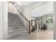 Carpeted stairs lead to the second floor, with a view to the kitchen and dining area at 2336 W Laredo Ln, Phoenix, AZ 85085