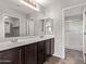 Bathroom with double vanity, large mirror, tile floors, and shower at 2547 E Vermont Dr, Gilbert, AZ 85295