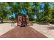 Community playground featuring a slide, climbing structure, and soft rubber surface for safety at 2547 E Vermont Dr, Gilbert, AZ 85295