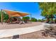 Sidewalk leading to community playground and picnic area with shade structures at 2547 E Vermont Dr, Gilbert, AZ 85295
