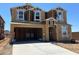 New construction home featuring a two-car garage and a modern design with WaterBlock protection, ready for customization at 27271 N 73Rd Ln, Peoria, AZ 85383