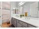 Bathroom featuring a double vanity with sleek fixtures and a shower at 2830 S Riata Ct, Gilbert, AZ 85295