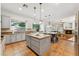 Well-lit kitchen with granite countertops, an island, and a view of the dining area at 2830 S Riata Ct, Gilbert, AZ 85295