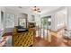 Bright living room with a fireplace, large windows, and hardwood floors at 2830 S Riata Ct, Gilbert, AZ 85295