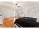 Spacious main bedroom featuring hardwood floors, a ceiling fan, and natural light at 2830 S Riata Ct, Gilbert, AZ 85295