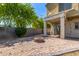 Cozy backyard featuring a paved patio, brick fire pit, and string lights at 336 N 168Th Dr, Goodyear, AZ 85338