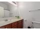 Standard bathroom showcasing a vanity with wood cabinets at 336 N 168Th Dr, Goodyear, AZ 85338