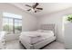 Bedroom with natural light, ceiling fan, and wood-style flooring at 336 N 168Th Dr, Goodyear, AZ 85338
